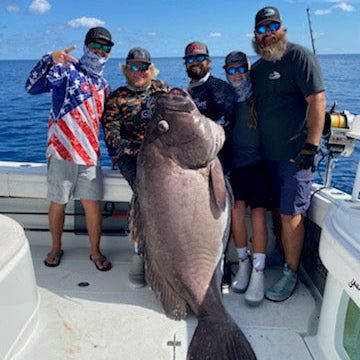 Anglers with a big deep drop grouper caught on Blackfin rods