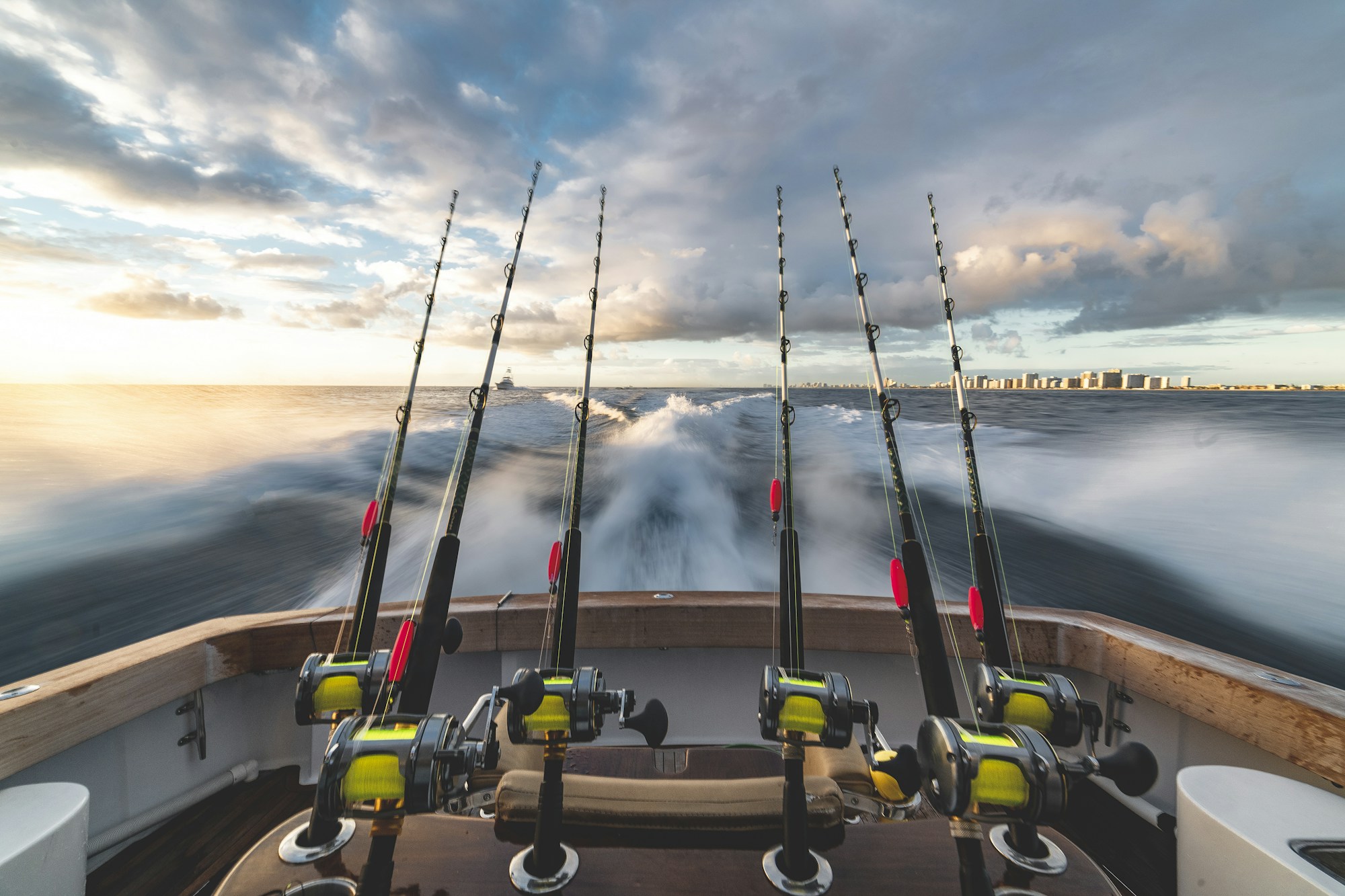 Rods rigged in holders aboard a sportfishing boat off Fort Lauderdale Beach, Florida