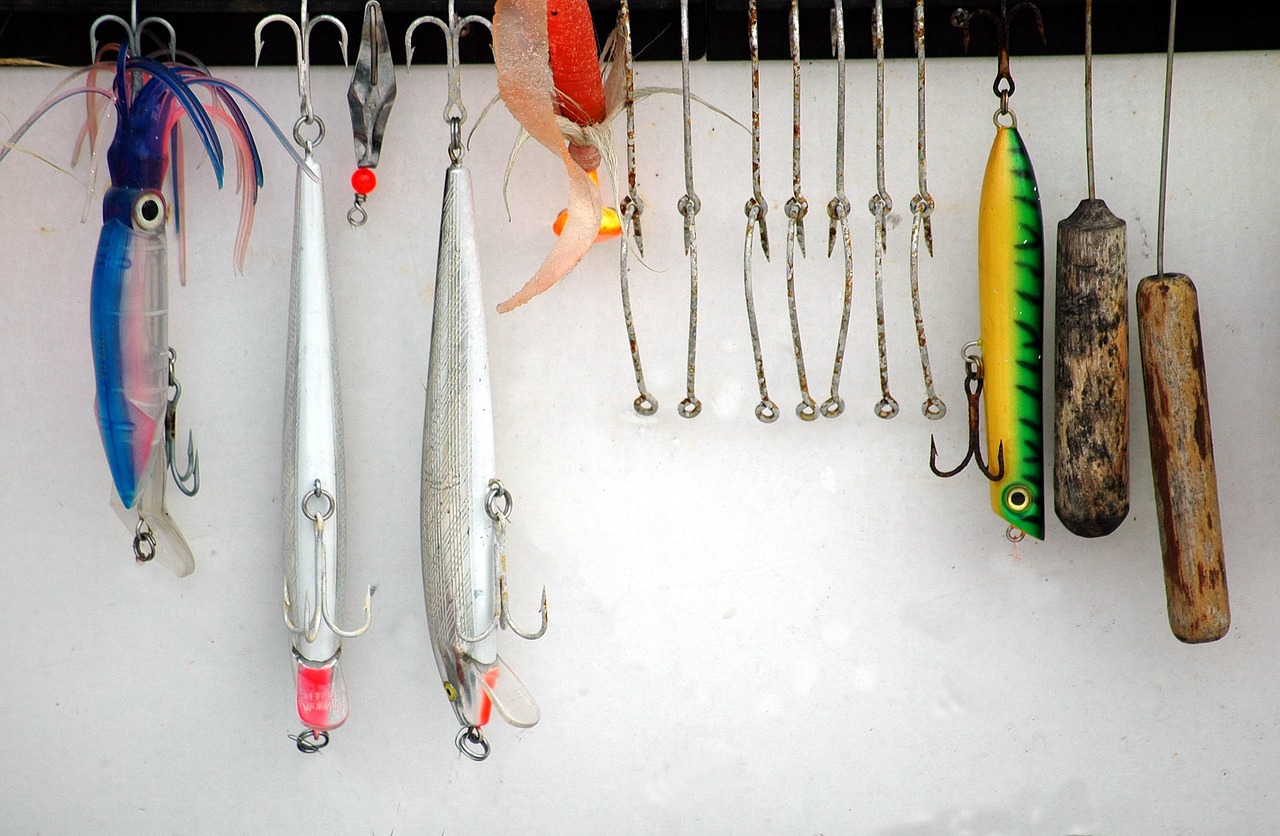 Trolling lures and hooks hanging aboard a charter fishing boat